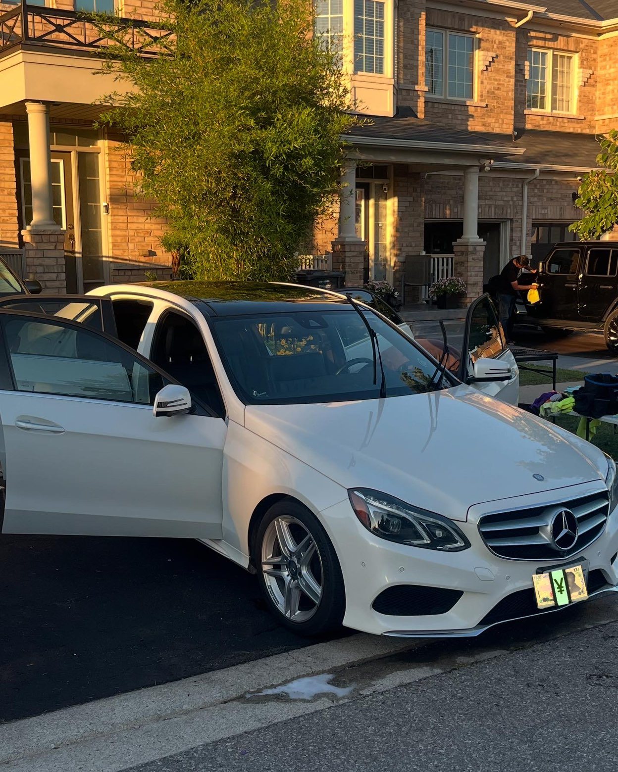 White Mercedes-Benz E-Class exterior at golden hour after detailing