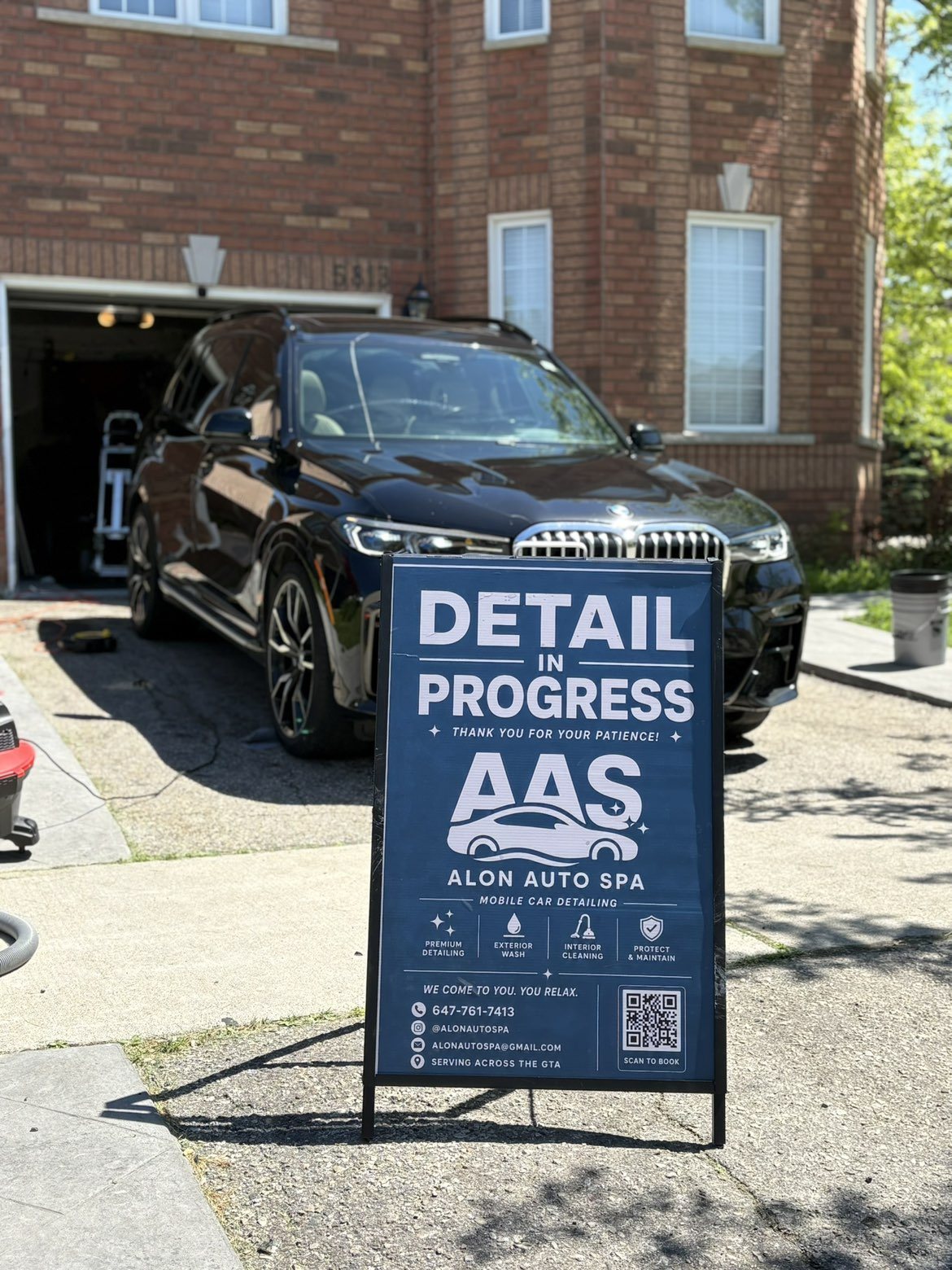 Detailing in progress on a luxury SUV