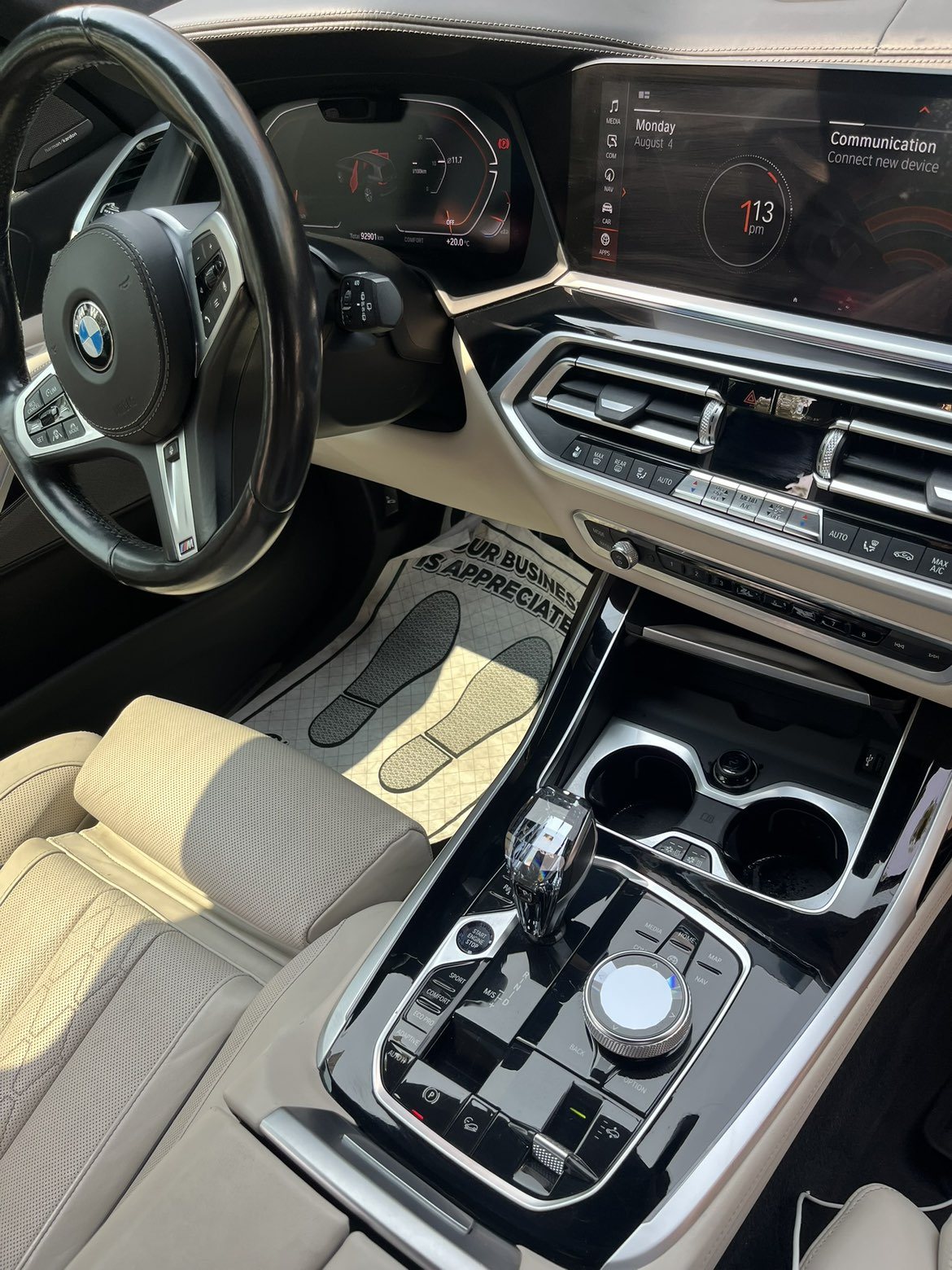 BMW X5 interior with cream leather and detailed center console