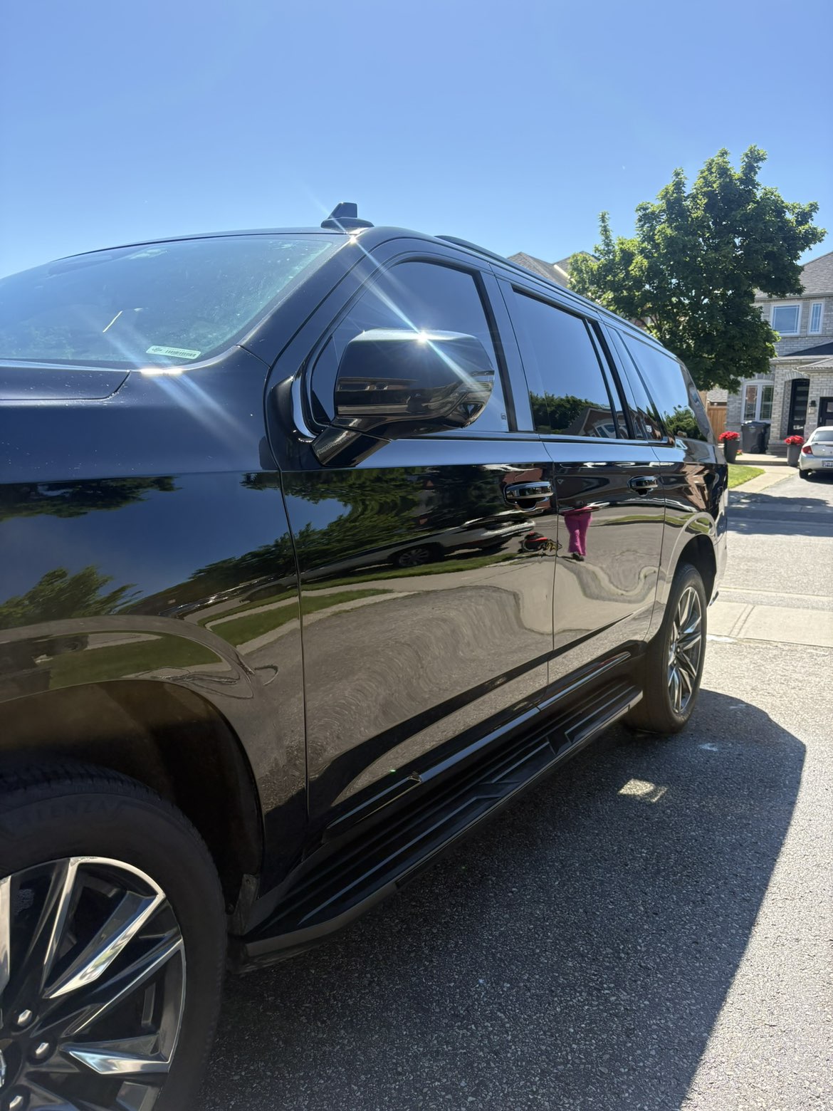 Black Cadillac Escalade with a deep mirror-gloss ceramic finish