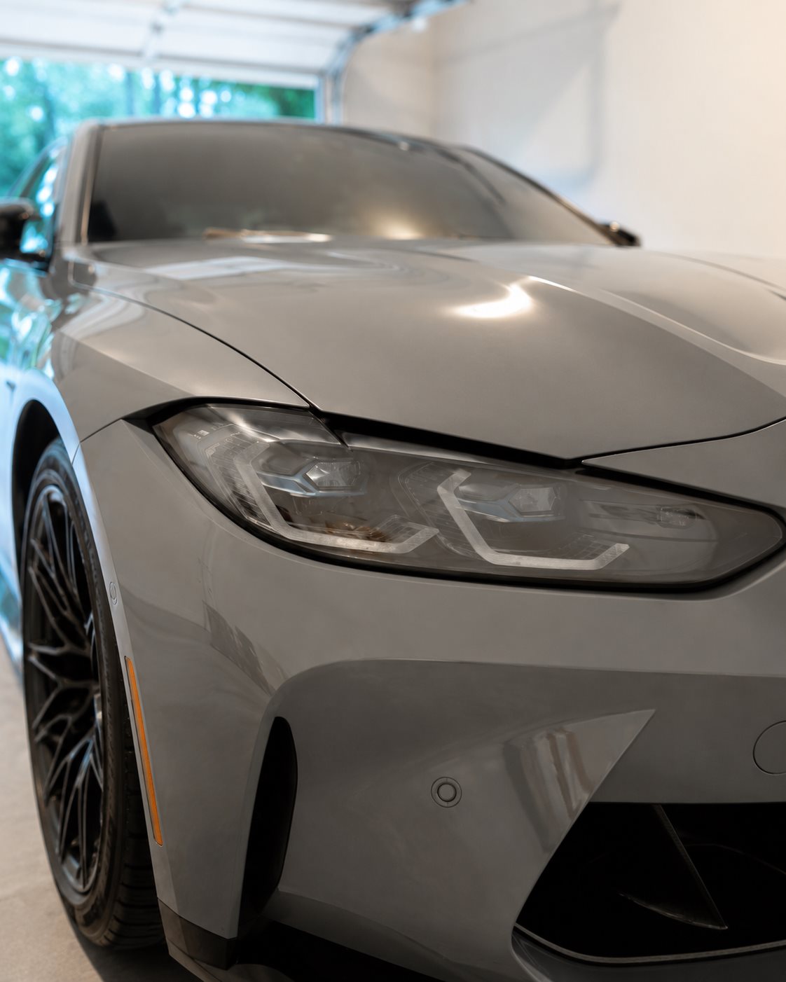 BMW M4 Competition headlight, crystal clear after restoration